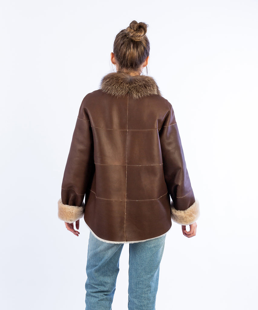 Abrigo doble faz piel a bandas contraste