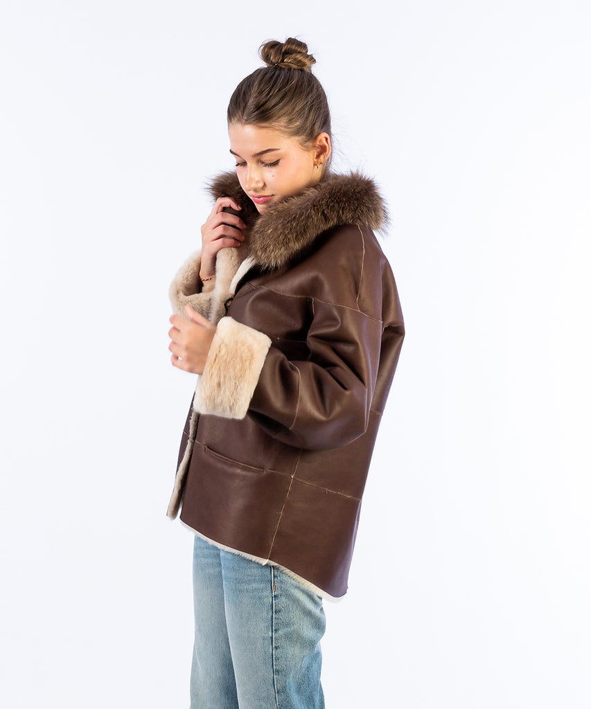 Abrigo doble faz piel a bandas contraste