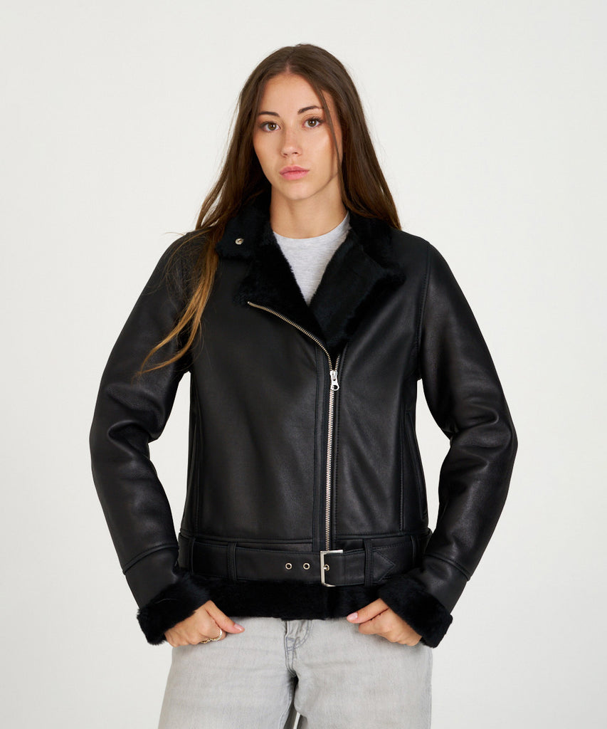Chaqueta de piel vuelta negra doble faz con interior de borreguito